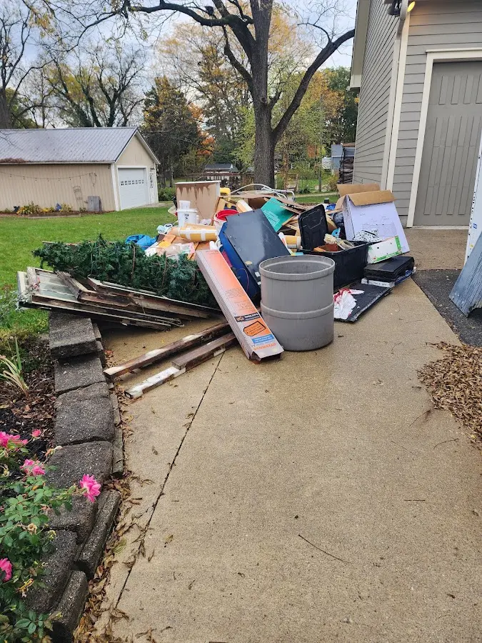 Dumpster being loaded with debris for Residential Dumpster Rental in Upper Leacock
